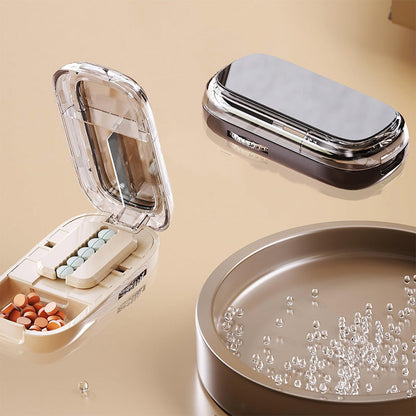 Scatola di pillole portatile con taglierin