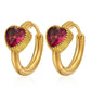 Orecchini huggie a cerchio dorati con zircone a cuore
