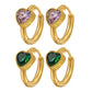 Orecchini huggie a cerchio dorati con zircone a cuore